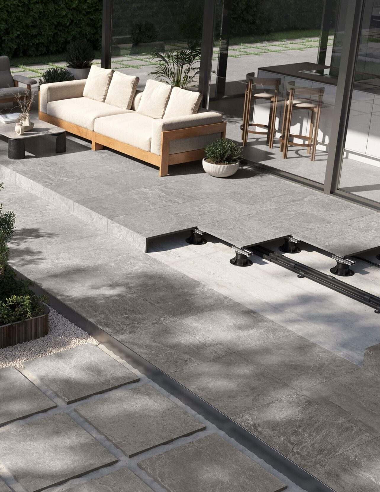 An outdoor patio shows multiple options for installation of porcelain pavers.